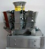 Automatic weighing machine for sticky products