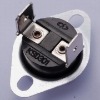 Phenolic thermostat with fixed Al cap